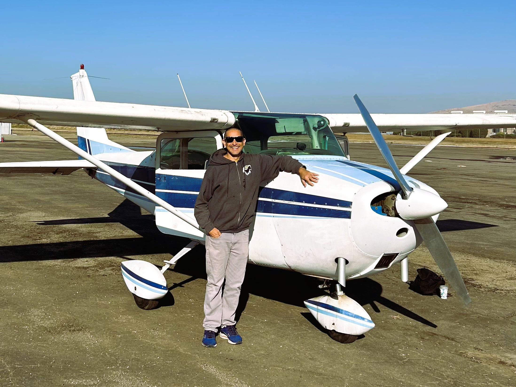 Photograph of Aaron Slaven in front of an aircraft.